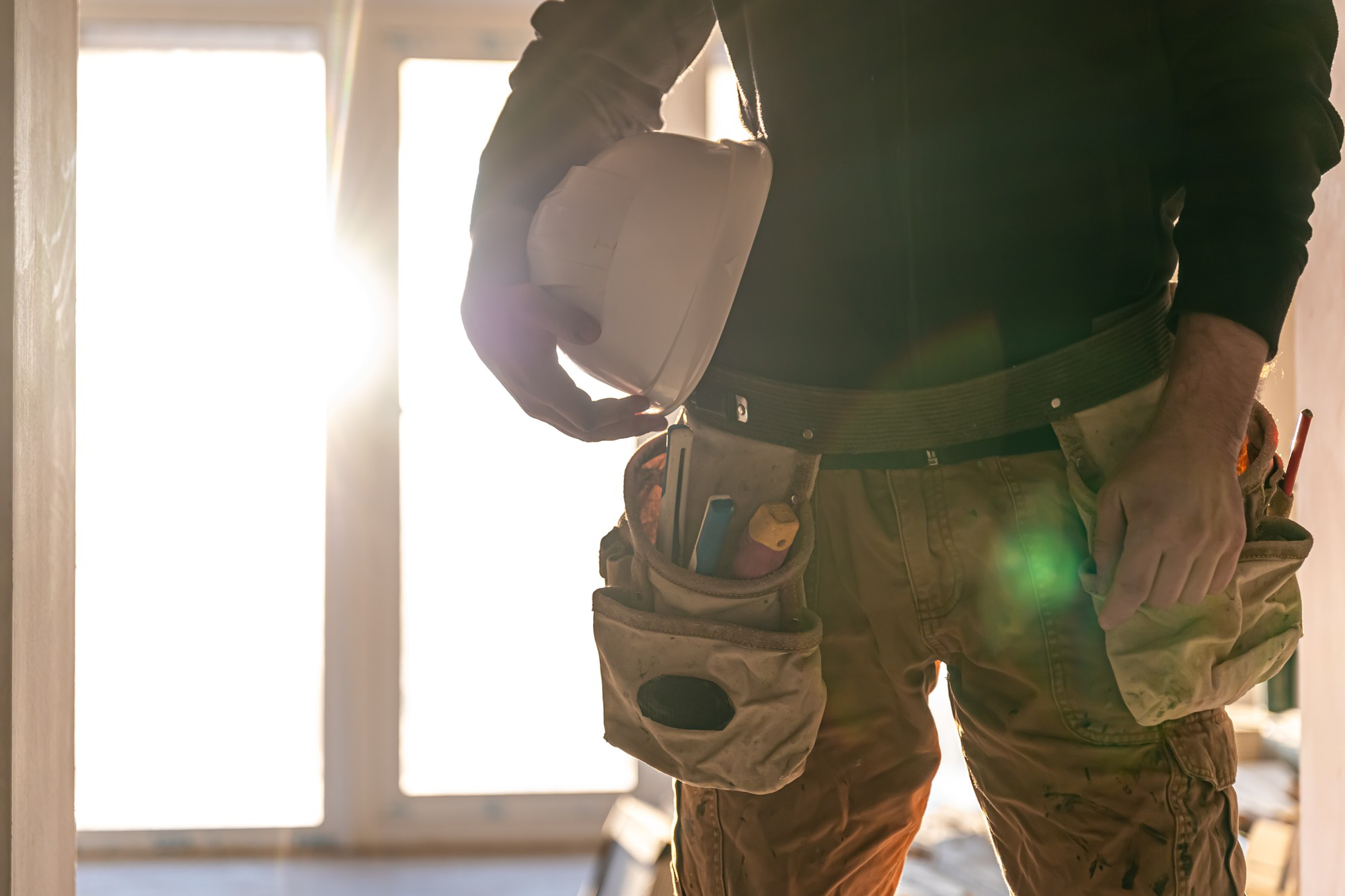 man-builder-holds-protective-helmet-his-hands-part-body